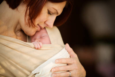 Mother holding newborn baby girl